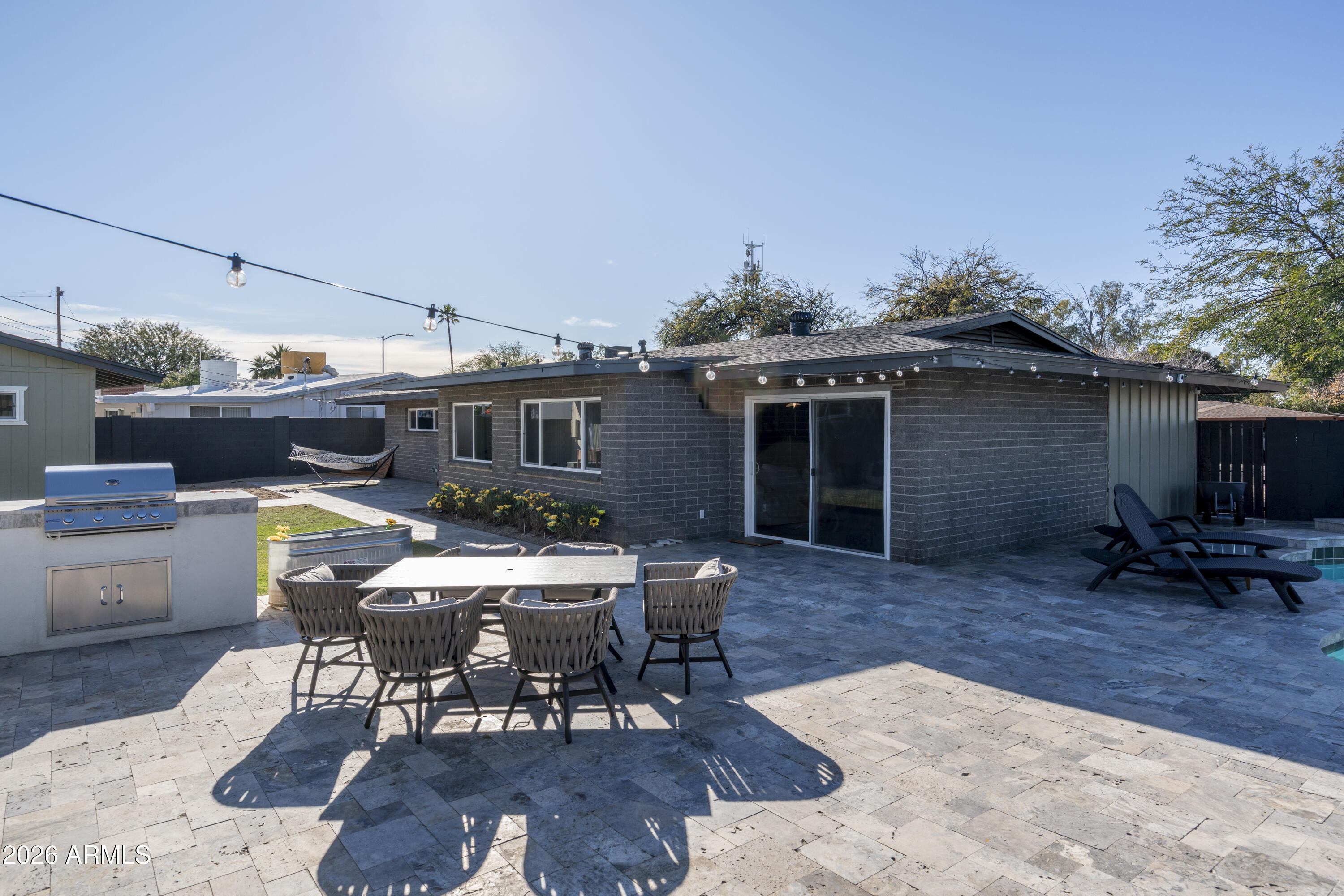 8049 North 10th Street Phoenix, AZ 85020 - Photo 35 of 40 a patio with table and chairs