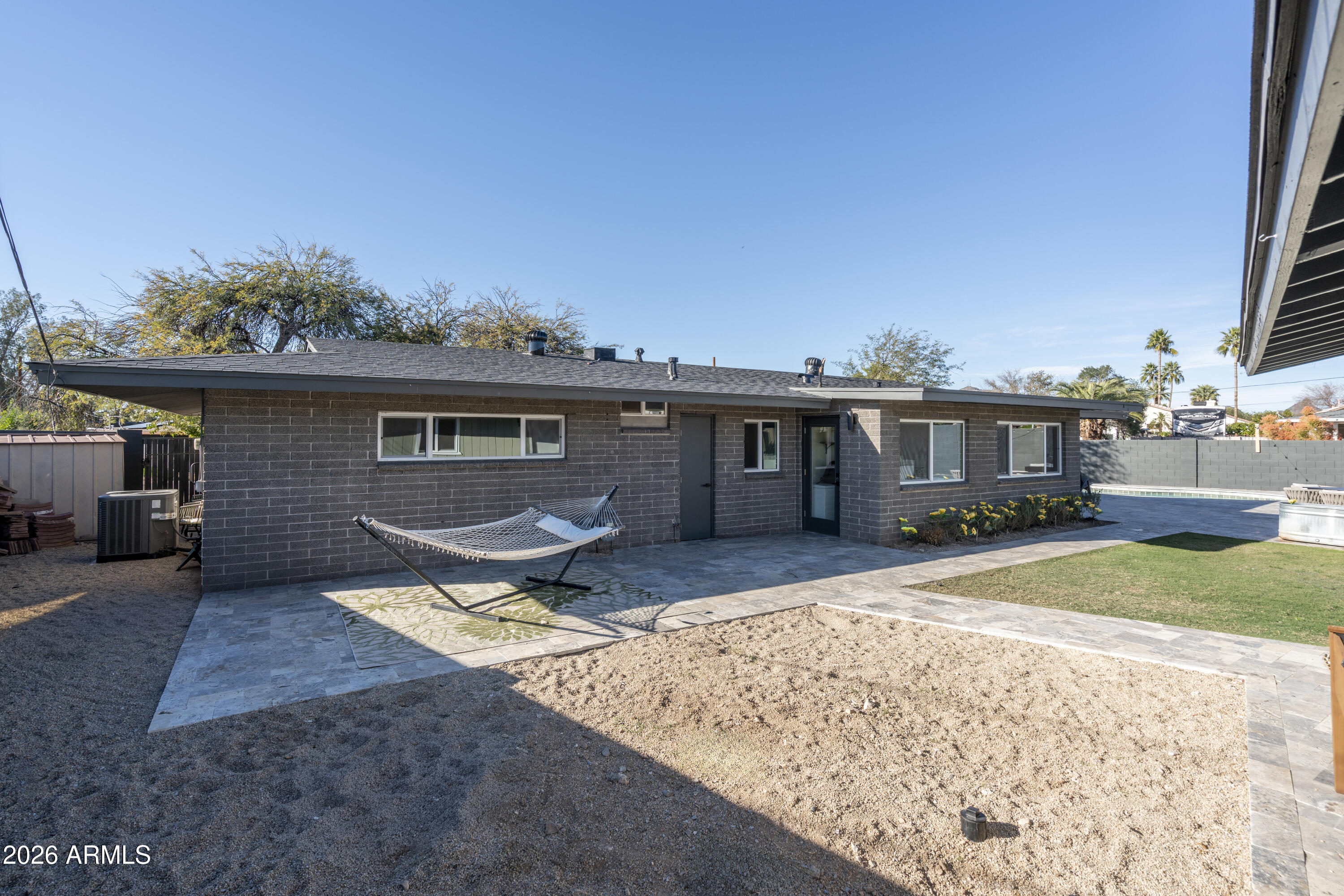 8049 North 10th Street Phoenix, AZ 85020 - Photo 38 of 40 a view of a yard in front of a house with large tree