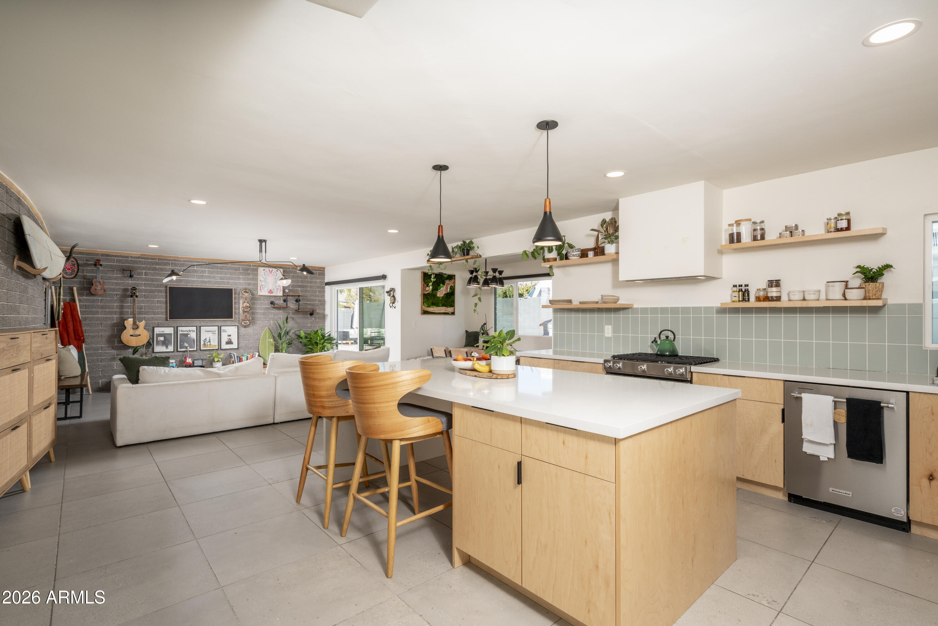 8049 North 10th Street Phoenix, AZ 85020 - Photo 5 of 40 a kitchen with a stove a sink and a refrigerator