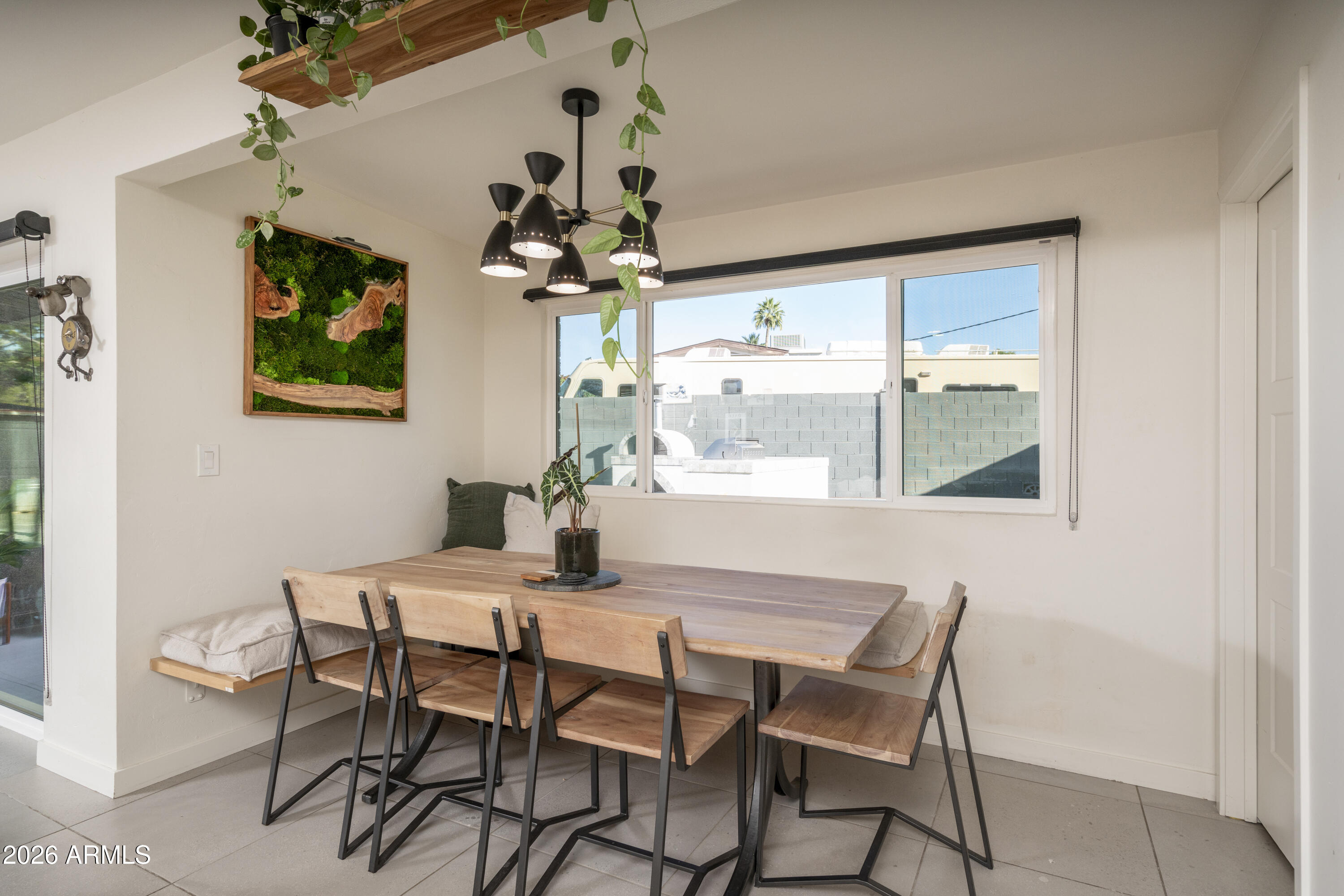 8049 North 10th Street Phoenix, AZ 85020 - Photo 6 of 40 a dining room with furniture and window