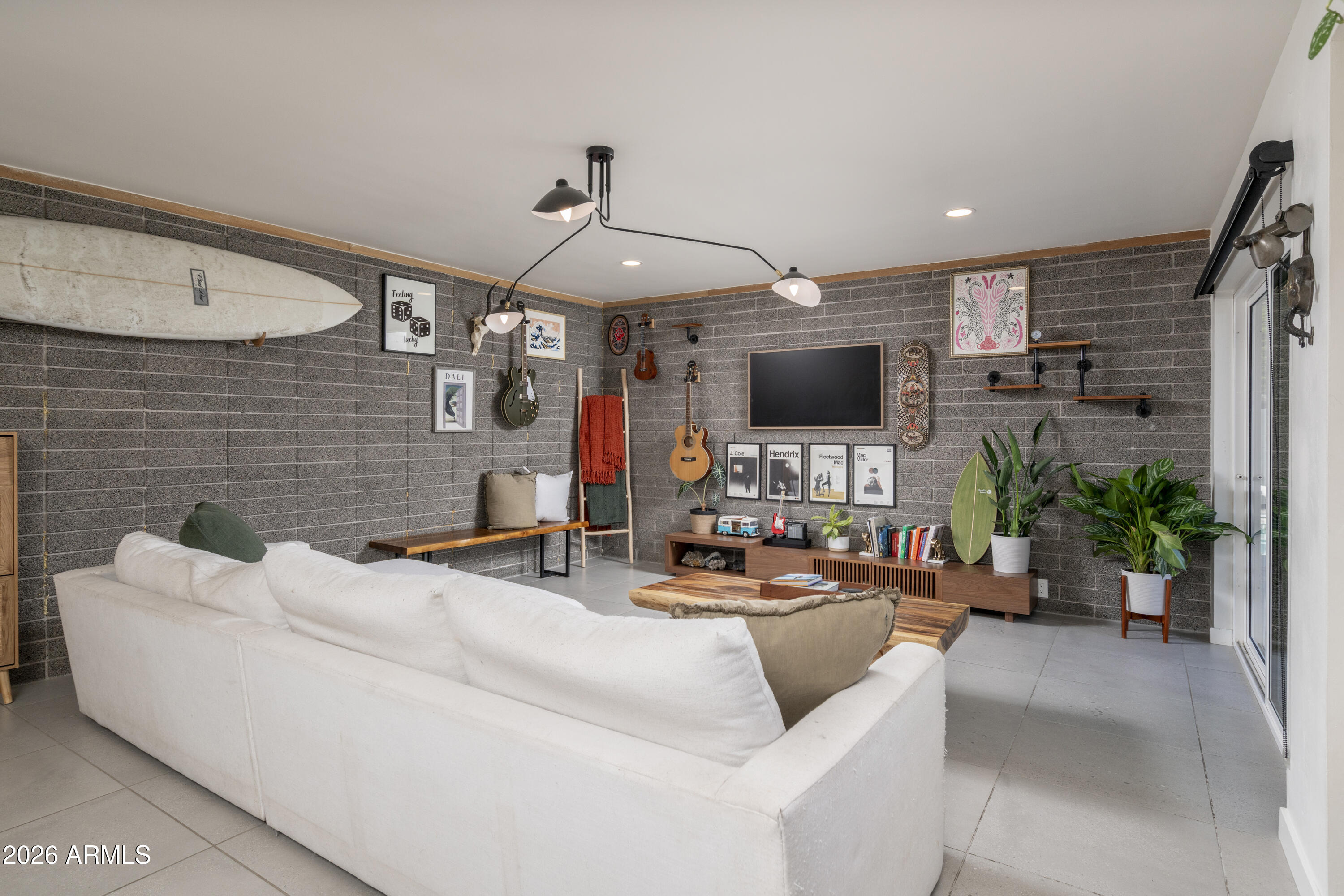 8049 North 10th Street Phoenix, AZ 85020 - Photo 9 of 40 a living room with furniture and a flat screen tv