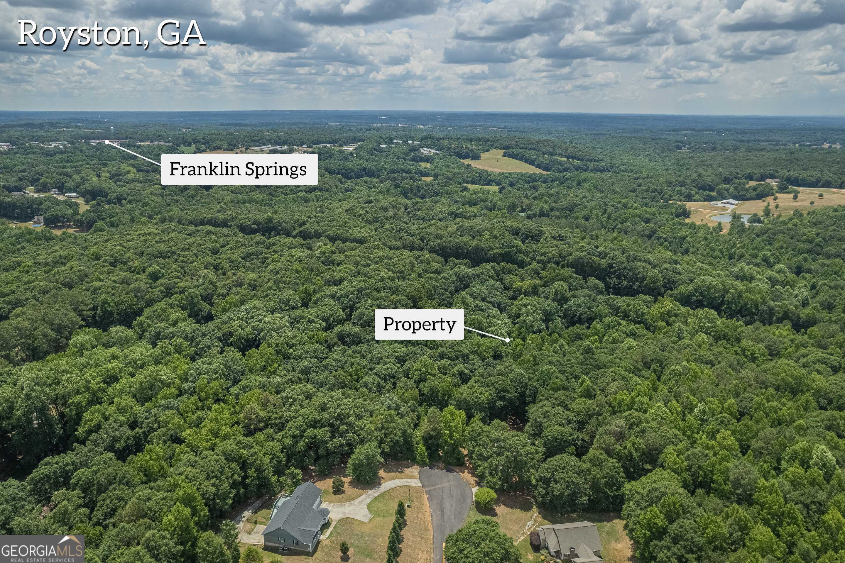 0 Harper Lane Royston, GA 30662 - Photo 6 of 18 a view of a sign board with yard and mountain view in back