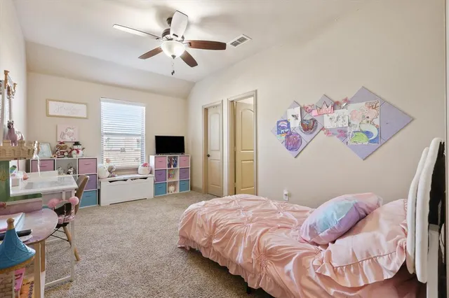 a bedroom with a bed and furniture