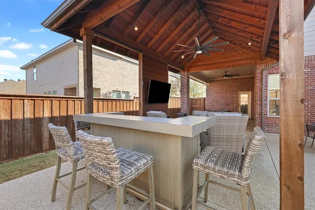 a dining room with furniture and a floor to ceiling window