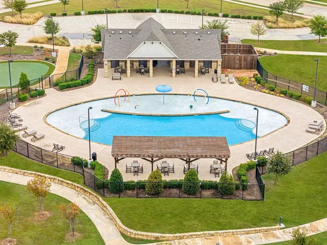 a aerial view of a house with a swimming pool