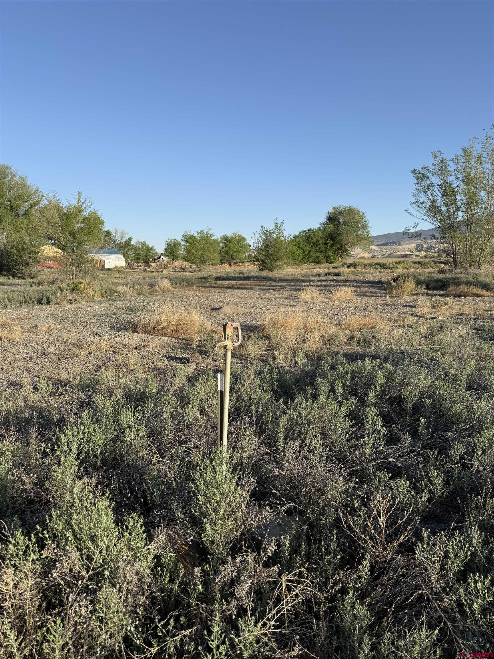 1475 And Tbd Highway Delta, CO 81416 - Photo 7 of 16 a view of a lake with a mountain in the background
