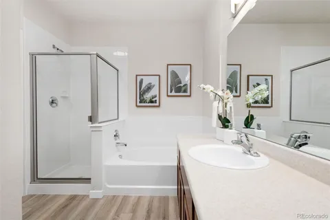 a spacious bedroom with a large bed and a large window