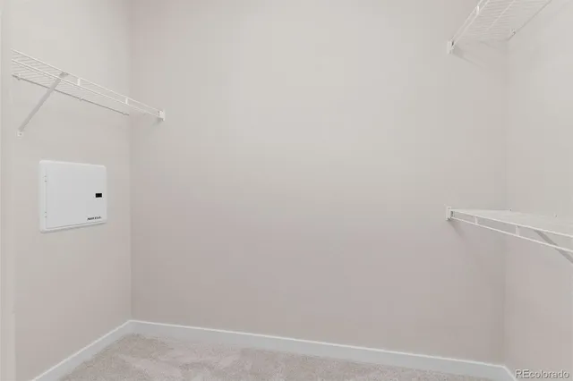 a dining room with furniture and a mirror