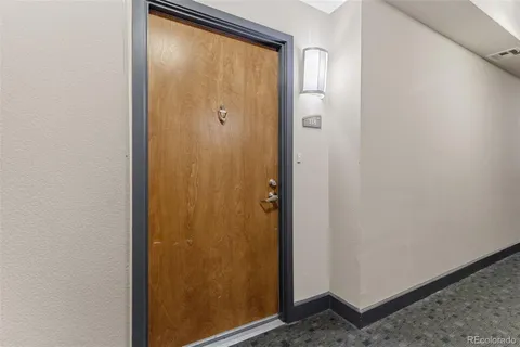 a view of a dining room with furniture and a potted plant