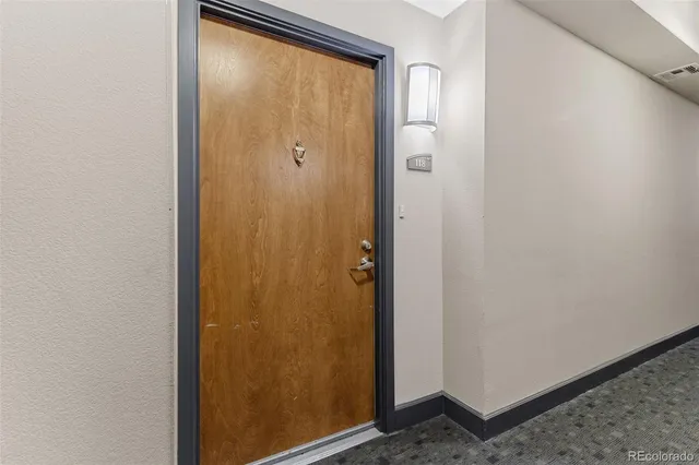 a view of a dining room with furniture and a potted plant