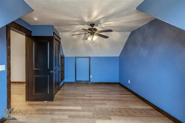 a view of a hallway with a chandelier