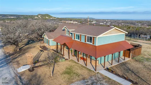 an aerial view of residential houses with wooden fence