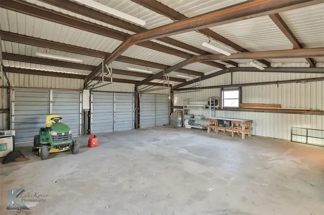 a view of parking garage with cars
