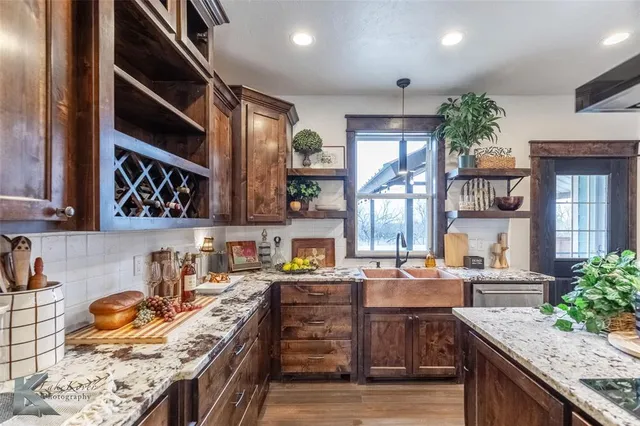 a kitchen with granite countertop lots of counter top space