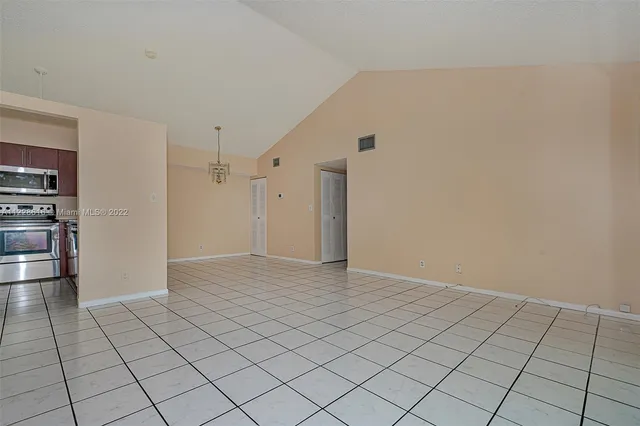 a view of a livingroom with a table and chair