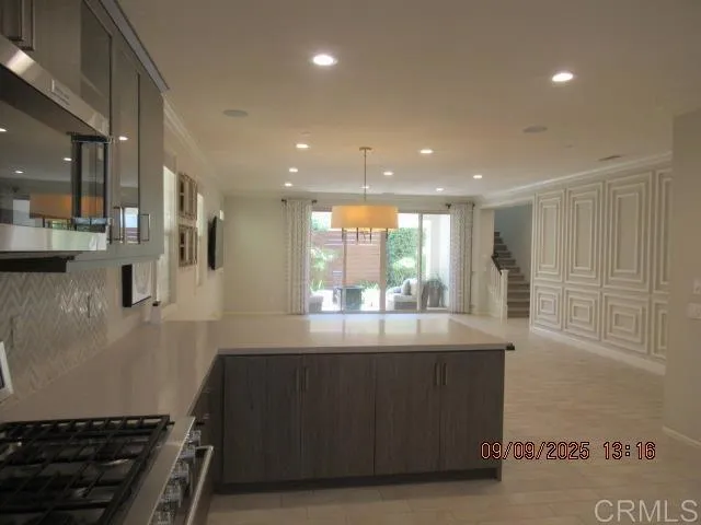 a kitchen with stainless steel appliances a refrigerator and a sink