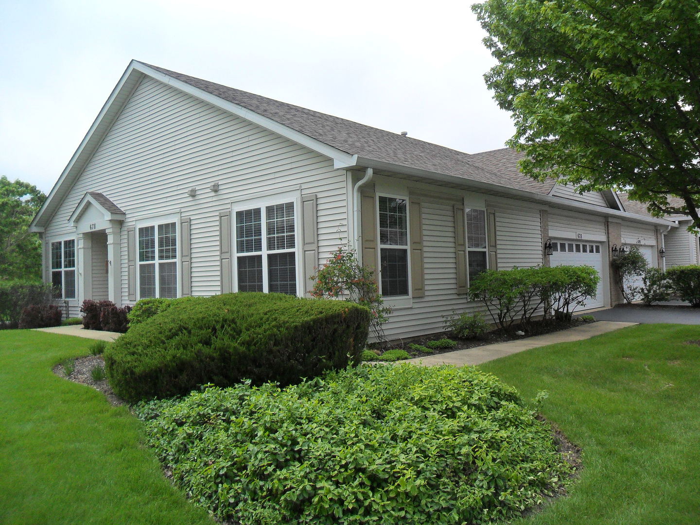 678 Cadillac Circle Romeoville, IL 60446 - Photo 2 of 19 a view of house with a yard and plants