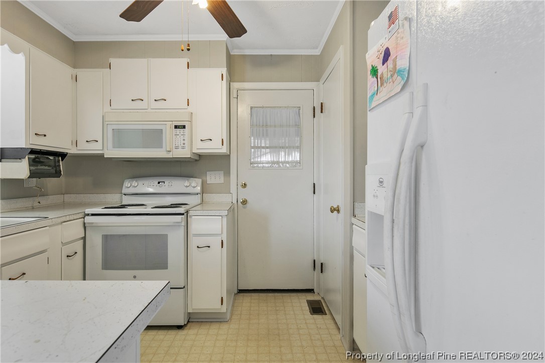 636 Pleasant Loop Fayetteville, NC 28311 - Photo 17 of 40 a kitchen with stainless steel appliances cabinets and a window
