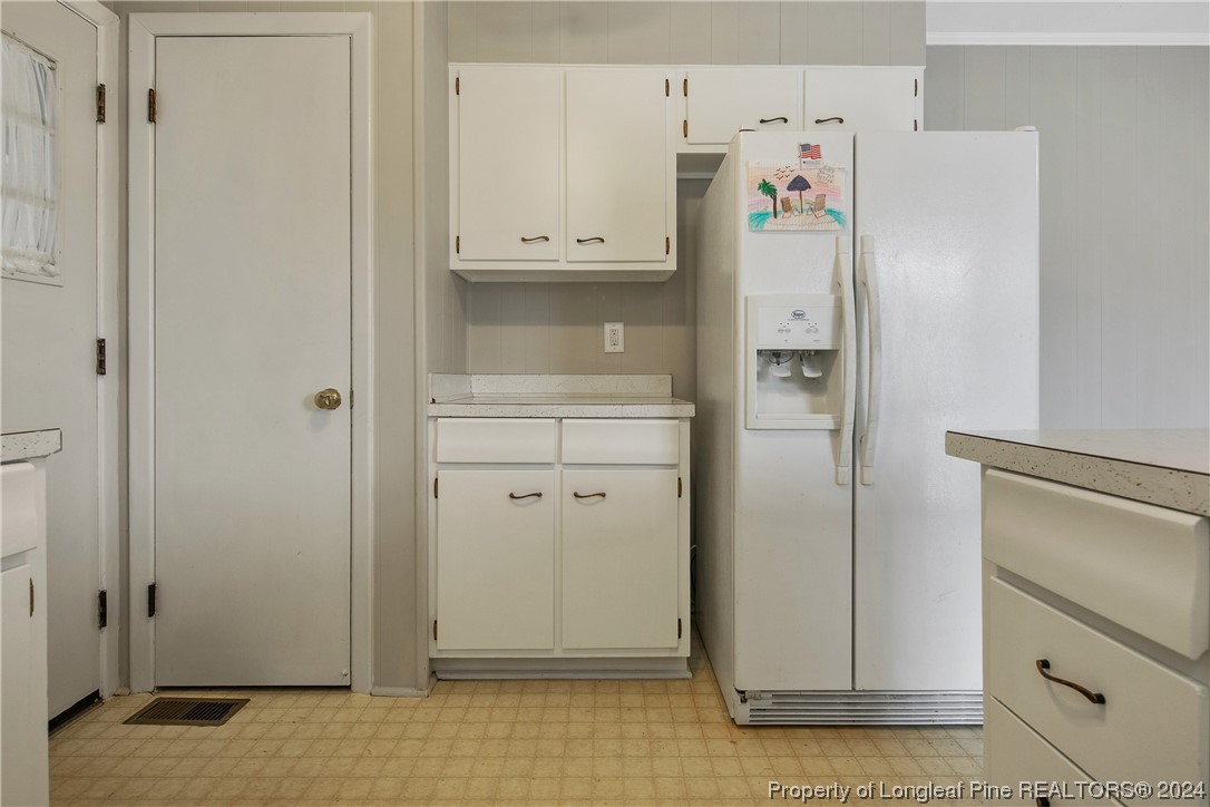 636 Pleasant Loop Fayetteville, NC 28311 - Photo 21 of 40 a white refrigerator freezer sitting inside of a kitchen