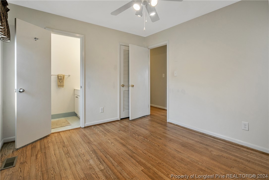 636 Pleasant Loop Fayetteville, NC 28311 - Photo 24 of 40 a view of an empty room with wooden floor