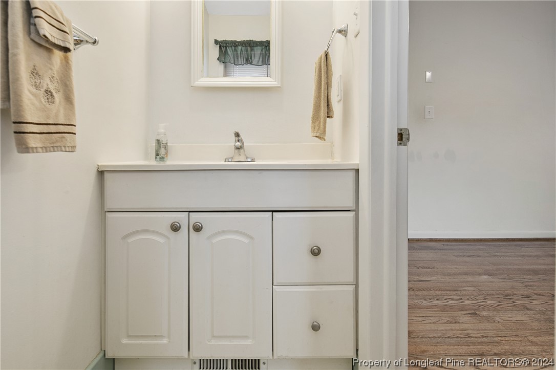 636 Pleasant Loop Fayetteville, NC 28311 - Photo 26 of 40 a bathroom with a sink and a mirror