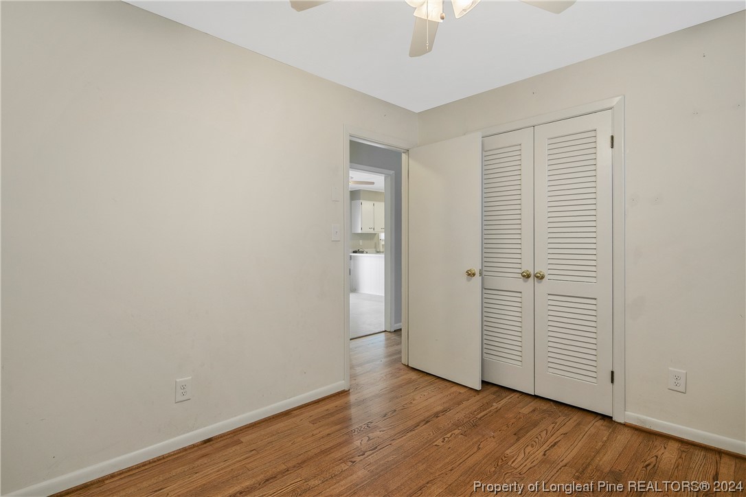 636 Pleasant Loop Fayetteville, NC 28311 - Photo 29 of 40 an empty room with wooden floor and closet