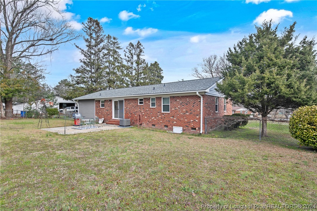 636 Pleasant Loop Fayetteville, NC 28311 - Photo 38 of 40 a view of a house with a yard
