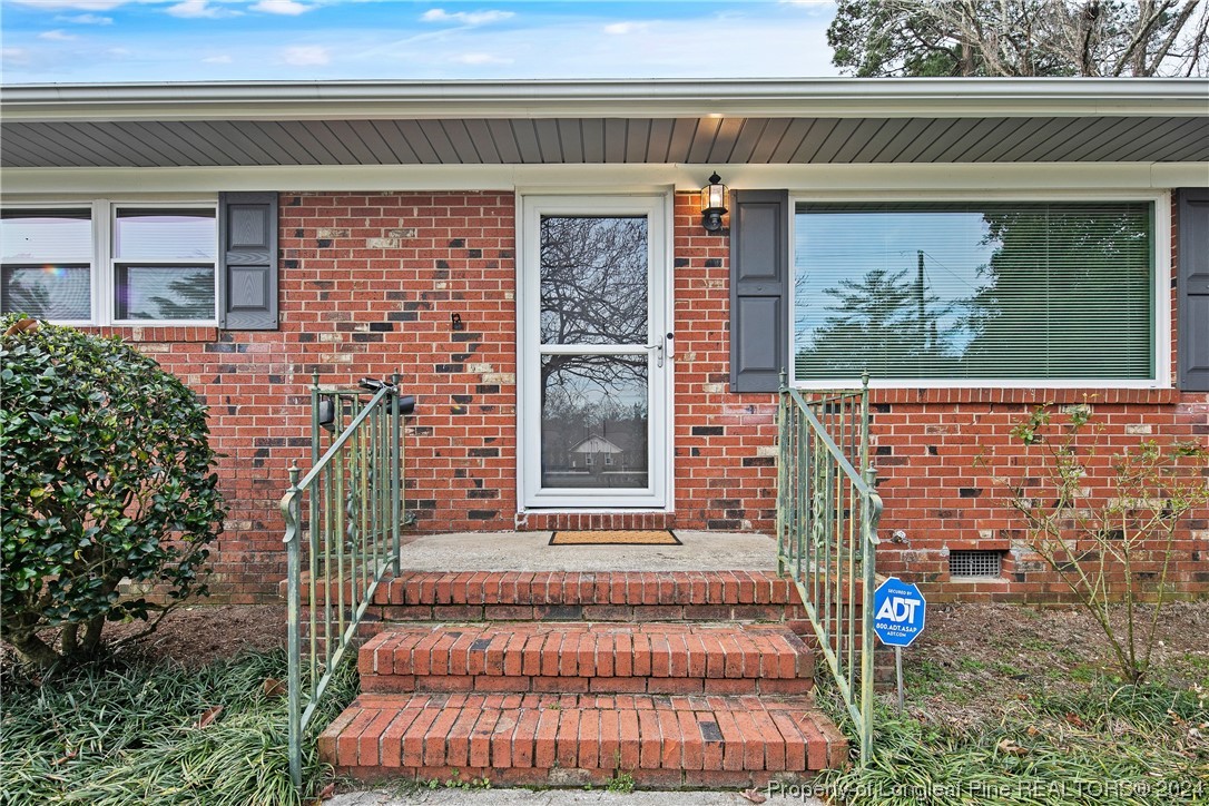 636 Pleasant Loop Fayetteville, NC 28311 - Photo 4 of 40 a front view of a house with a yard