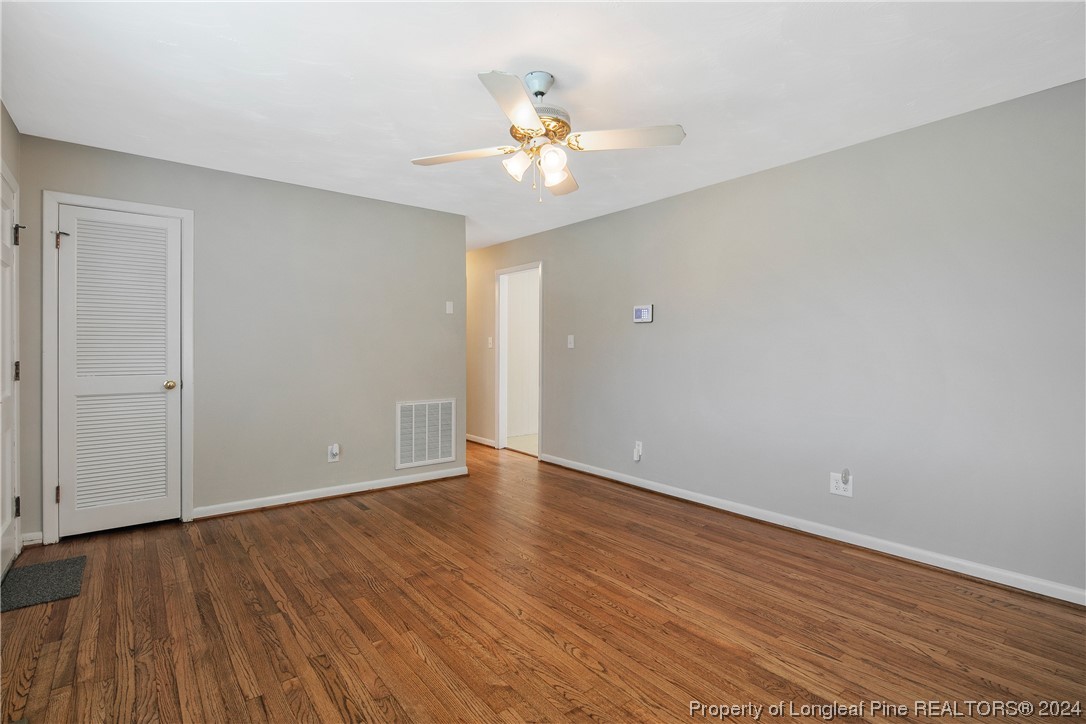 636 Pleasant Loop Fayetteville, NC 28311 - Photo 10 of 40 a view of an empty room with wooden floor
