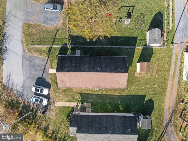 an aerial view of residential houses with outdoor space