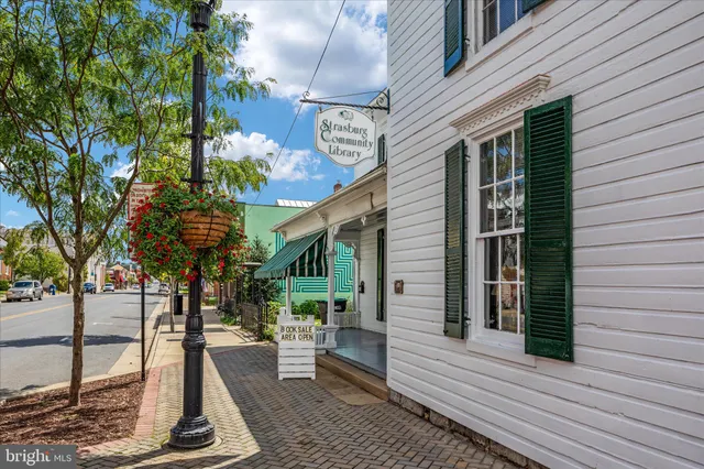 a view of a house with a tree