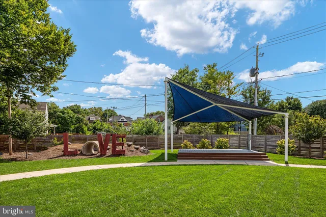 a view of a park with large trees