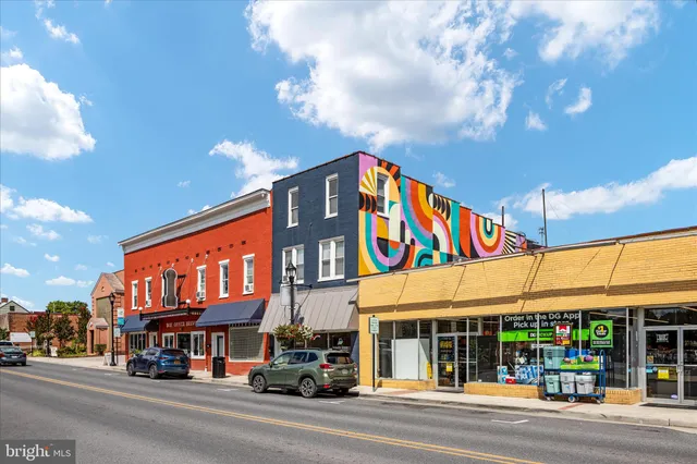 an aerial view of a brick building with many windows
