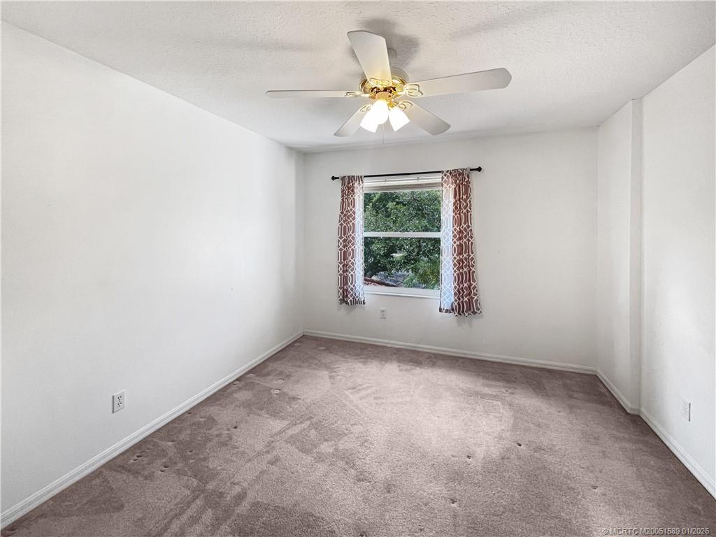 8006 Southwest Yachtsmans Drive Stuart, FL 34997 - Photo 18 of 42 an empty room with a window
