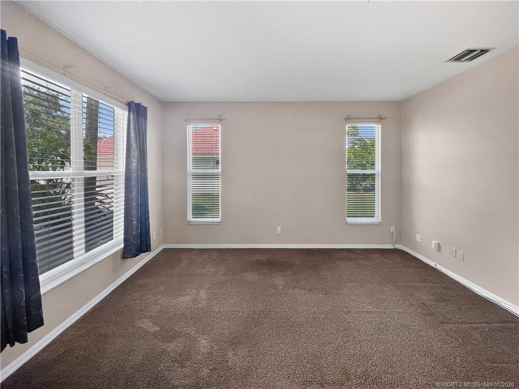 8006 Southwest Yachtsmans Drive Stuart, FL 34997 - Photo 33 of 42 a view of an empty room with a window
