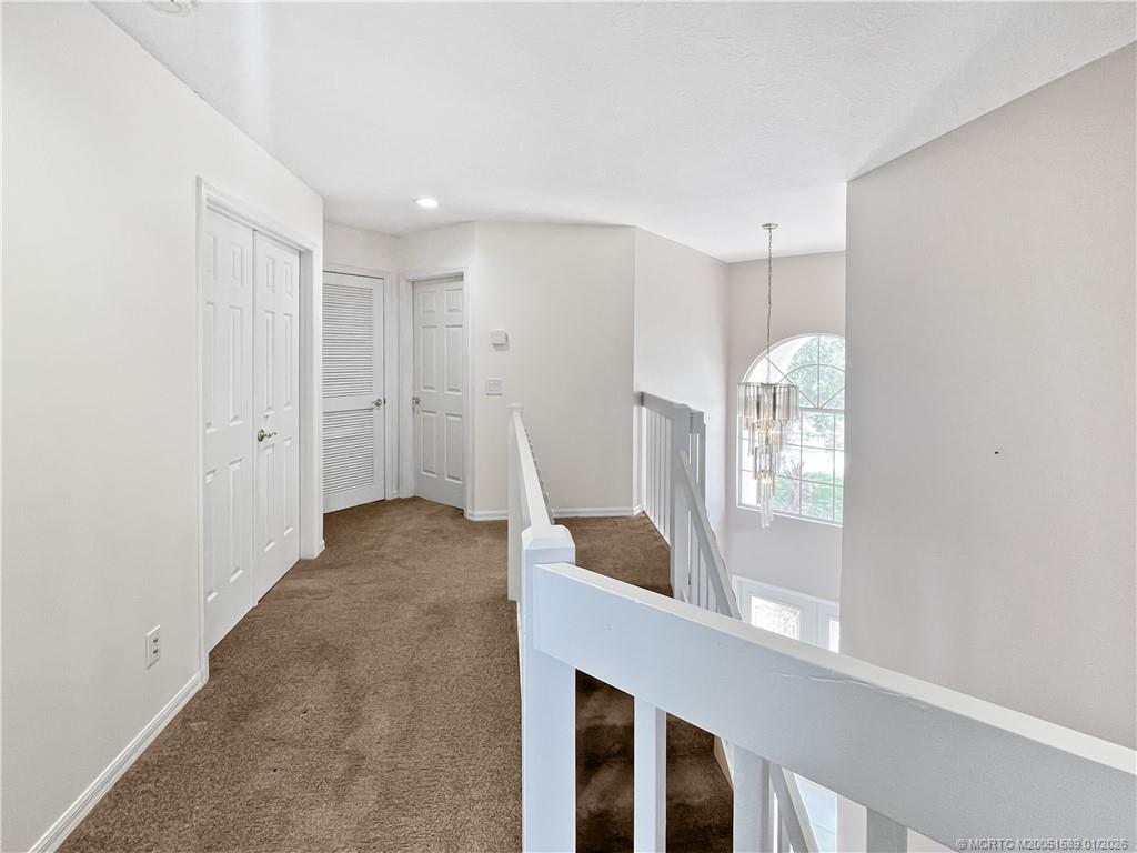 8006 Southwest Yachtsmans Drive Stuart, FL 34997 - Photo 36 of 42 a view of entryway with window and wooden floor