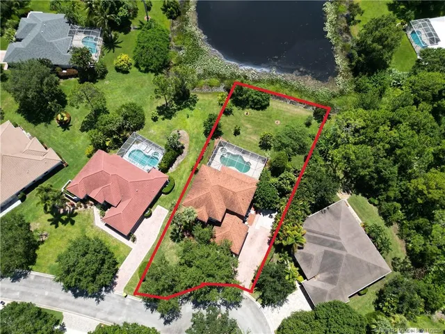 an aerial view of house with yard