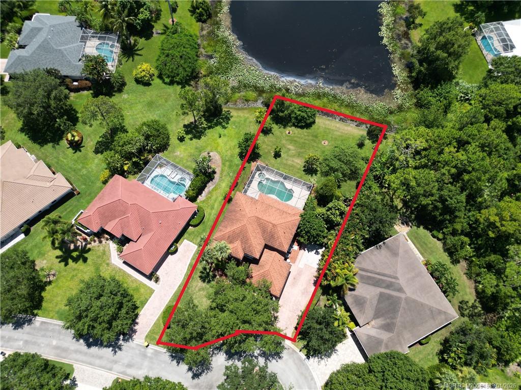 8006 Southwest Yachtsmans Drive Stuart, FL 34997 - Photo 4 of 42 an aerial view of house with yard