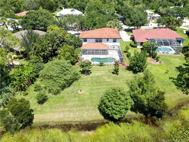 an aerial view of house with yard