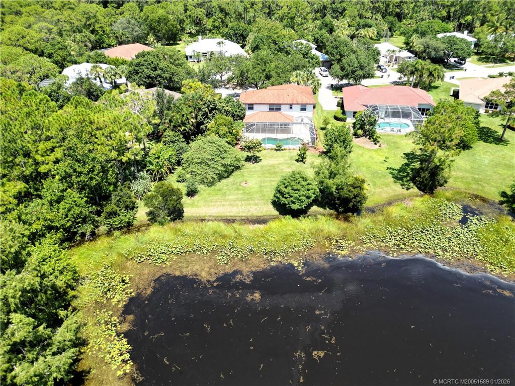 8006 Southwest Yachtsmans Drive Stuart, FL 34997 - Photo 6 of 42 an aerial view of residential house with yard and green space