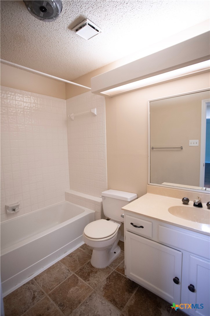 712 Brazos Drive Temple, TX 76504 - Photo 24 of 28 a bathroom with a sink a toilet and shower