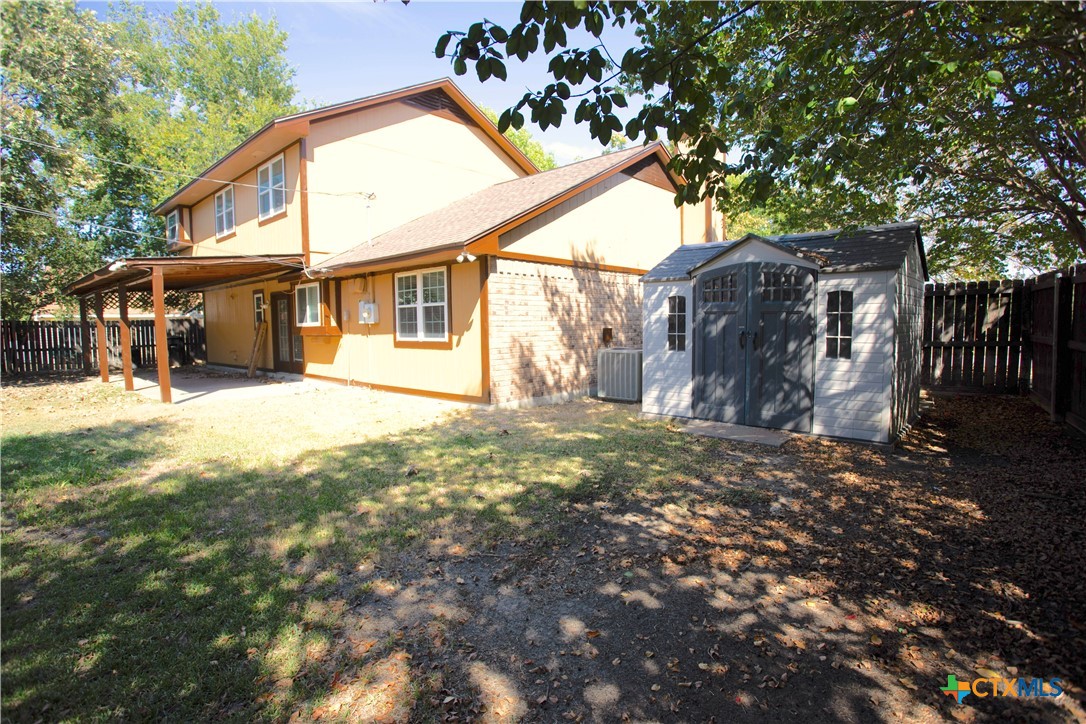 712 Brazos Drive Temple, TX 76504 - Photo 26 of 28 a view of a yard in front of house with trees
