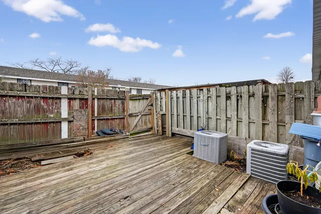 a picture of a bench in front of a wall