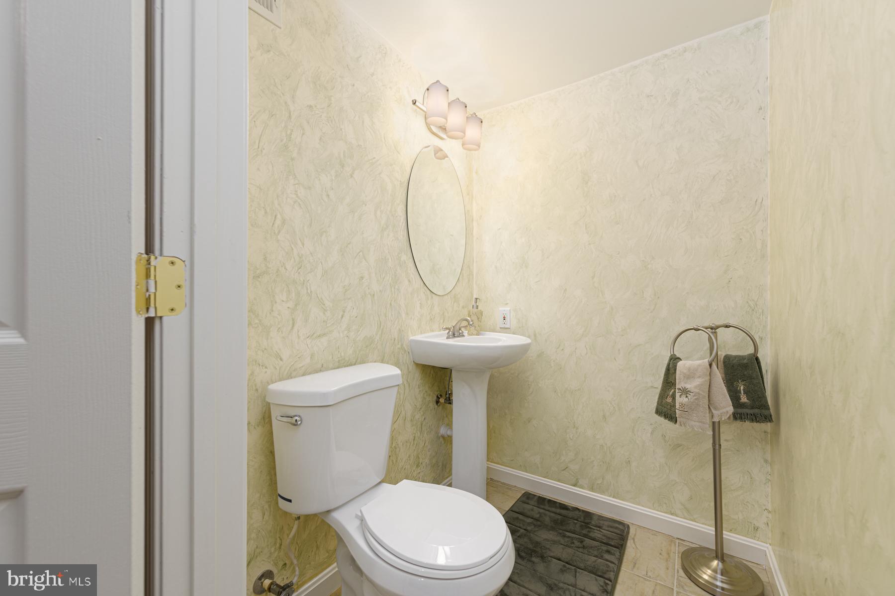 20501 Beaver Ridge Road Montgomery Village, MD 20886 - Photo 29 of 32 Half bathroom in the lower level