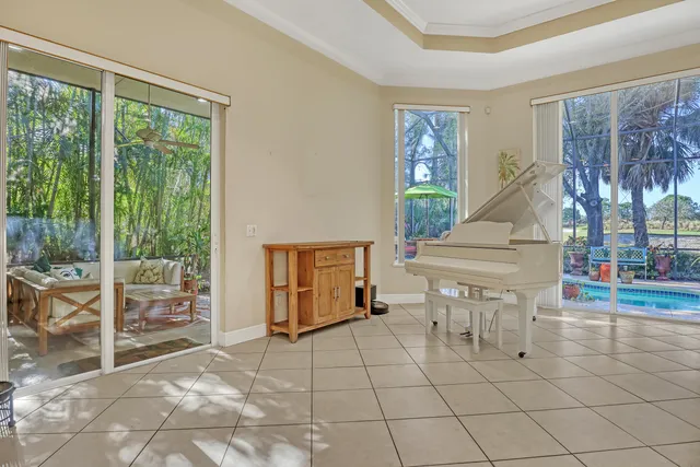 a living room with furniture a chandelier and a chandelier