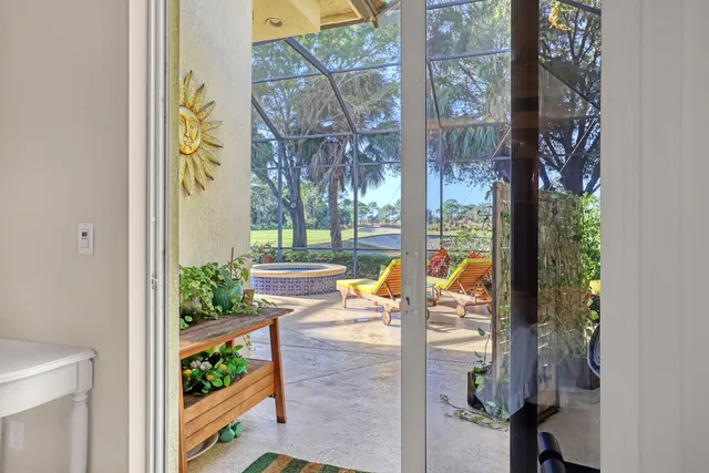a bathroom with a tub a sink and a large mirror