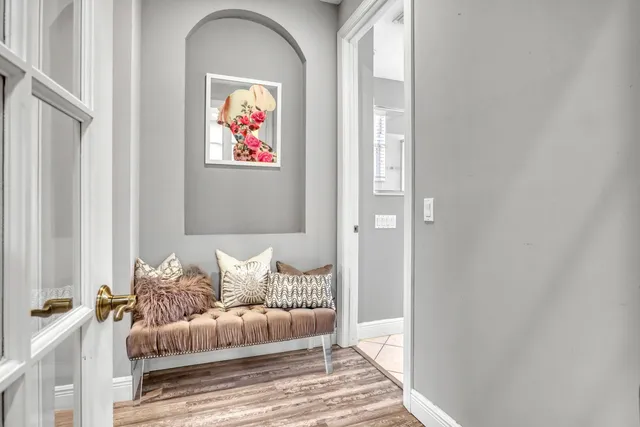a bathroom with a granite countertop sink a toilet and shower