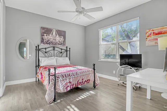 a room with a mirror and a flat screen tv