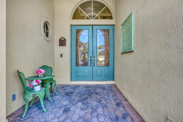 a view of a dining room with furniture and window