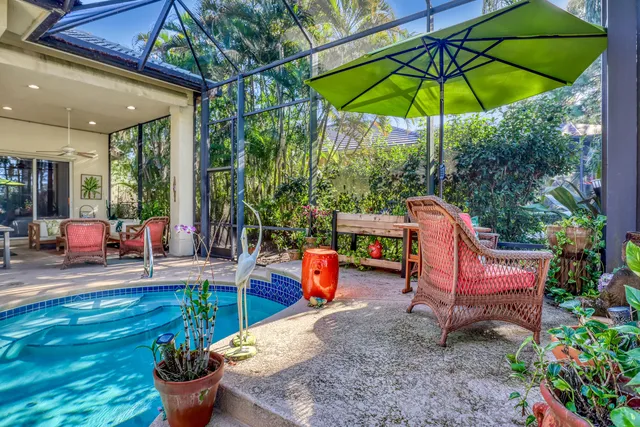 an aerial view of residential houses with outdoor space and ocean view